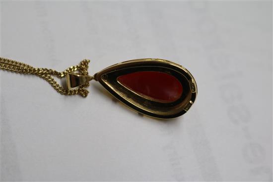 An Italian 18ct gold and pear shaped coral drop pendant, on an 18ct gold chain, pendant overall 33mm.